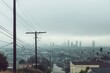© quietmind_art - Foggy urban landscape with distant city skyline and power lines.