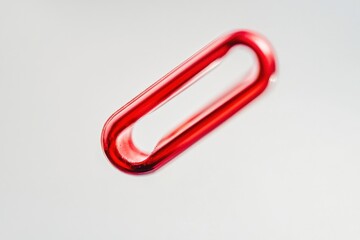 Wall Mural - a red plastic link on a white background