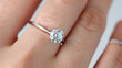 © hocine - Elegant solitaire diamond ring on a delicate finger showcasing brilliance and refined luxury for celebrations or romantic occasions