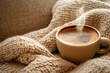 © multasam - Steaming coffee cup on cozy knitted blanket. (1)