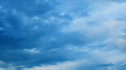 Wall Mural - Beautiful blue sky with clouds on bright sunny day for abstract background. White clouds moving towards the horizon.