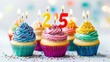 © Napasnan - A delightful 2025 image with cupcakes topped with candles forming the numbers, celebrating a sweet New Year on white