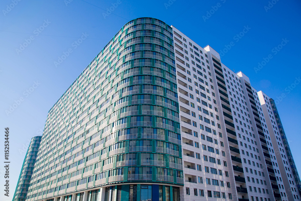 Modern residential high-rise buildings with glass facades and balconies ...