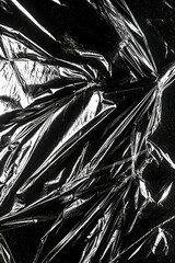 Wall Mural - a black plastic sheet with a white background