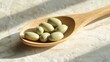 © P.G - Closeup of wooden spoon with vitamin and mineral pills, on a colored background, showcasing the vibrant pills with ample room for design or text