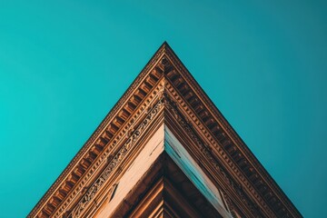 Poster - A close-up view of an ornate building corner against a clear blue sky.