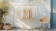 © EUT - Neutral-toned clothing hangs on a rack outdoors. Perfect for fashion blogs, websites, and showcasing minimalist apparel.