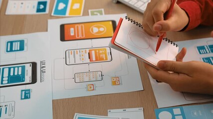 Wall Mural - panorama video of startup company employee planning on user interface prototype for mobile applicati