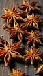 © Janmo - Warm star anise spice scattered on a wooden background, spice, dried, warm colors