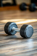 © Emanuel - Dumbbell on the floor in the gym, fitness equipment