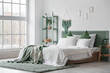 © Pixel-Shot - Modern bed with green plaid and shelving unit in interior of bedroom