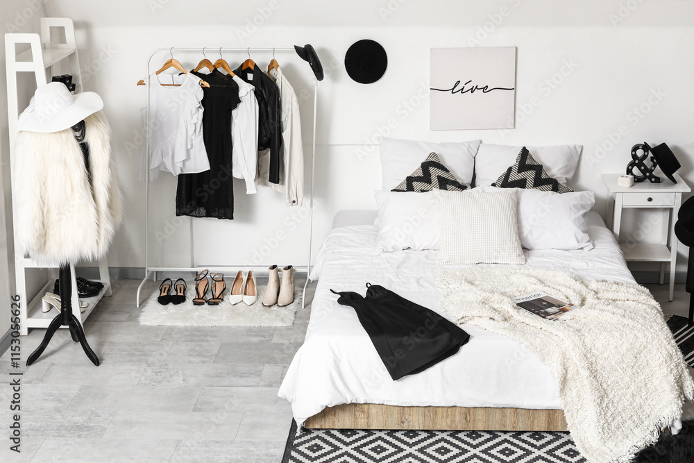 Interior of modern comfortable bedroom with clothes rack and mannequin