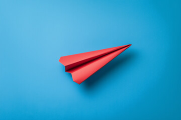 Red paper plane and business strategy on blue background, Business success, innovation and solution concept