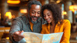 © D-stock photo - happy african american couple looking at map in cafe. travel concept