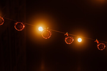 Wall Mural - Red Christmas balls hang on the street