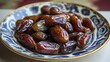 © Nijat - Dried dates fruits showcased on a plate, highlighting the natural beauty and texture of dried dates. This depiction emphasizes the rich, sweet essence of dates in a visually appealing way.