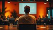 © ArzStudio - Cinematic back view of speaker at business conference, audience and projector screen, warm orange lighting, leadership talk