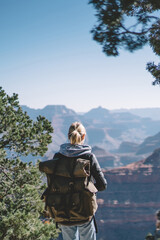 Wall Mural - young hipster girl wanderlust spending weekends on exploring grand canyon national park hiking with 