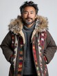 © taelefoto - Stylish man with beard wearing warm coat and sweater in neutral background