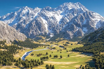 Wall Mural - A breathtaking mountain landscape with snow-capped peaks and a serene valley below.