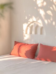 Canvas Print - Sunlit bedroom with coral pillows and white bedding.