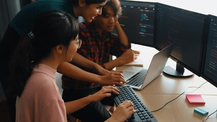 Slow motion back end software developer engineer for computer programming working together on debugging writing computing code, solving complex algorithms display on monitor in office. Burgeoning