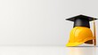 © DIAHIMAGESNEW - Graduation cap on hard hat, signifying education in construction.