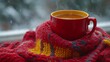 © Toni - Warm beverage in red mug on cozy knit.