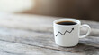 © Tanakorn - coffee cup with growth graph design on wooden table