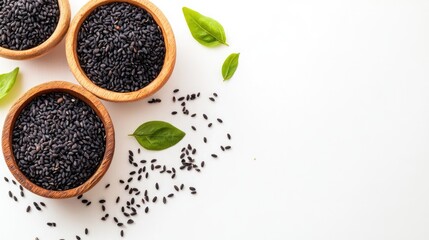 Canvas Print - fresh black rice in wooden bowls with scattered rice grains and green basil leaves on a white background