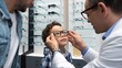 © Stanley - Ophthalmologist examining patient's eyes for routine eye sight test care
