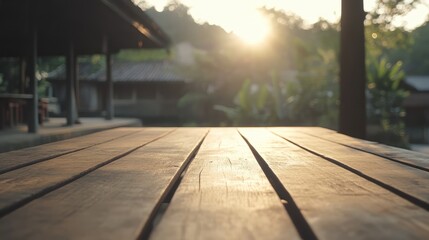 Wall Mural - Empty wooden table with blurred background and sunlight creating a warm atmosphere for relaxation and gatherings in nature.