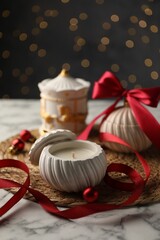 Wall Mural - Soy wax candles on white marble table, closeup. Beautiful Christmas decor