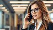 © Konstantin - Businesswoman Making a Business Call on Her Phone: A focused image of a businesswoman making a call on her smartphone, showcasing concentration and professionalism in the business world.  Good for bus