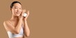 © Pixel-Shot - Pretty Asian woman holding jar of softening cream on beige background with space for text