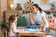 © Pixel-Shot - Female speech therapist with little girl pronouncing letter C in office