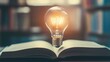 © Mohammed - A glowing lightbulb hovers above an open book, symbolizing the power of knowledge and new ideas. The warm light casts a soft glow on the pages.