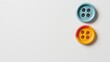 © Дмитрий Першин - Vibrant four-hole buttons on minimalist white background for sewing projects