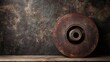 © Espresso - A close-up of a vintage rusted disc brake, showcasing industrial design and texture against a dark backdrop.