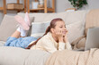© Pixel-Shot - Teenage girl watching movie on laptop at home