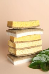 Wall Mural - Stack of different sponges on beige background, closeup