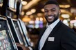 © Milos - A happy casino employee in formal attire stands beside a slot machine, radiating warmth and professionalism while interacting with players in a lively setting.