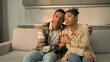 © Yuliia - Upset African American married couple sad family renters home owners sit on sofa cuddling worried moving out apartment frustrated woman and man relocation bank debt credit mortgage eviction sale house