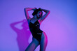 © Beauty Hero - Photo of girl in black leather costume feel passionate isolated ultraviolet neon background