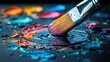 © Olga - A detailed view of a brush in the center of a wet pool of vibrant pigment
