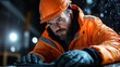 © Maximages  - A hardworking construction worker donned in orange safety gear, concentrating intently on his task amidst a downpour, encapsulating dedication and resilience.