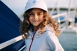 © Iigo - Portrait of a beautiful little girl on the deck of a yacht