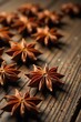 © Prasert - Warm star anise spice scattered on a wooden background, aromatic, spice
