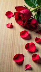 Wall Mural - Red rose petals on a light brown wooden surface, flowers, rose, brown