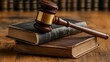 © Anugrah - Gavel rests on aged law books suggesting justice